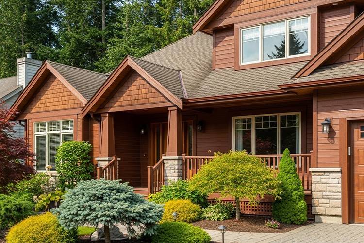 A well-maintained wooden house exterior with a smooth, fresh paint finish showing proper protection and curb appeal.