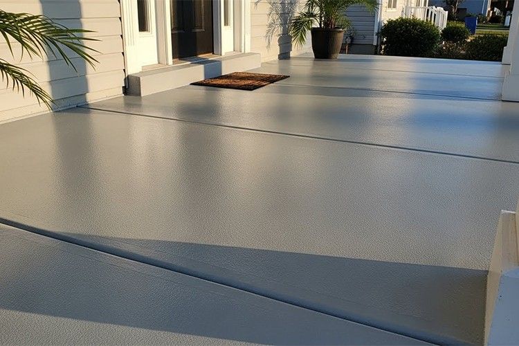 Finished concrete porch coated with the best outdoor concrete paint for durability and weather resistance.